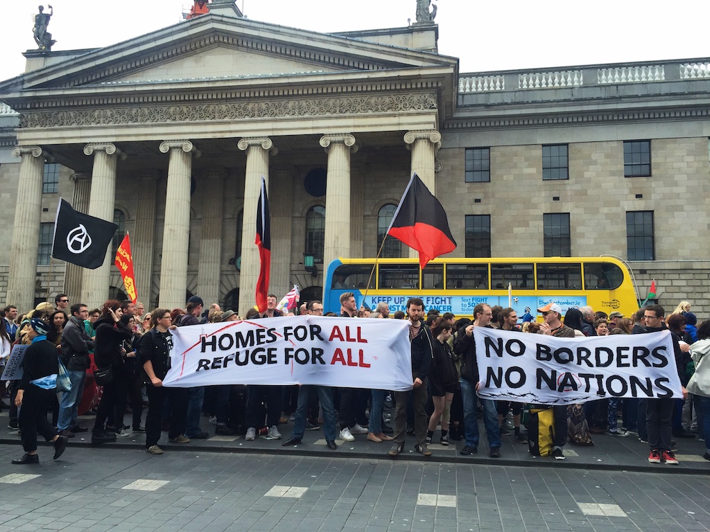 No Borders No Nation banner and Homes for all Refuge for all banners at GPO Dublin for Refugees are Welcome protest